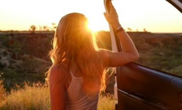 woman holding vehicle door