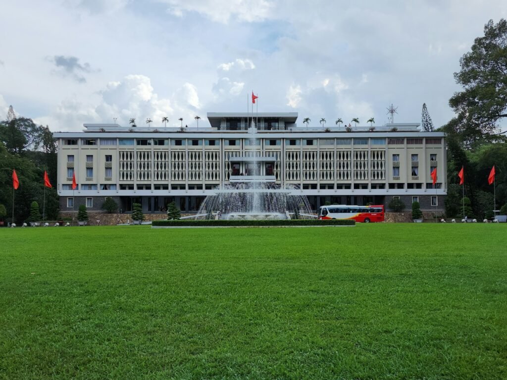 A large building with a fountain in front of it