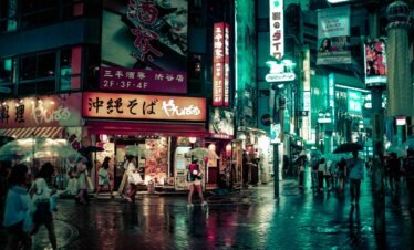 people walking near buildings at night