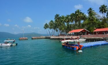 a group of boats floating on top of a body of water