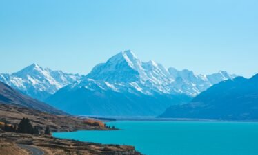 body of water surrounded by mountains