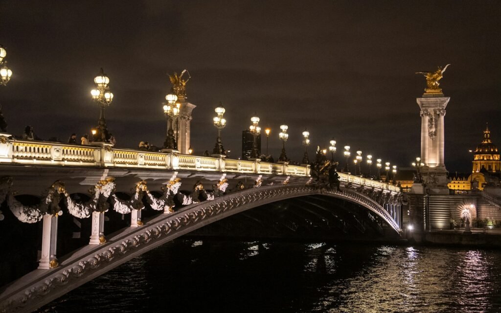 a bridge over a body of water at night