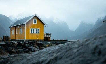 yellow house under whiet sky