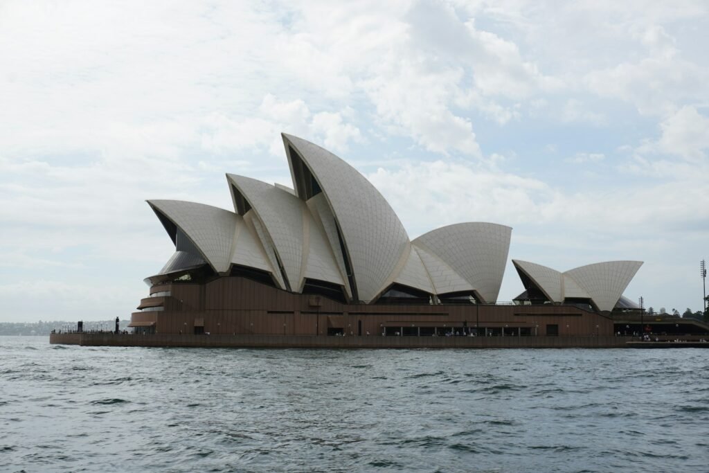 A picture of the sydney opera house taken from the water