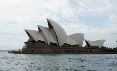 A picture of the sydney opera house taken from the water