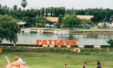 a body of water with a boat in it and people around it