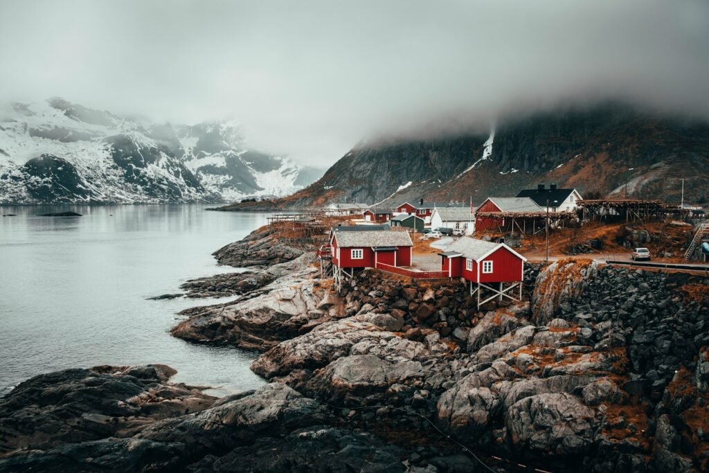 red and grey houses near river during daytime