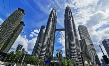 people walking on street near high rise buildings during daytime