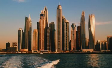 high rise buildings near sea during daytime