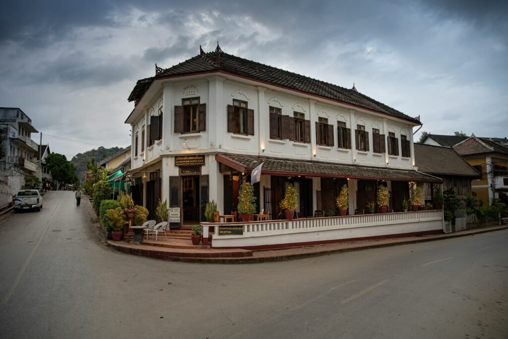 A large white building sitting on the side of a road